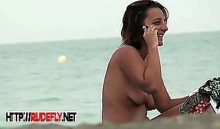 Beautiful fresh faced teen plays convenient the beach nude